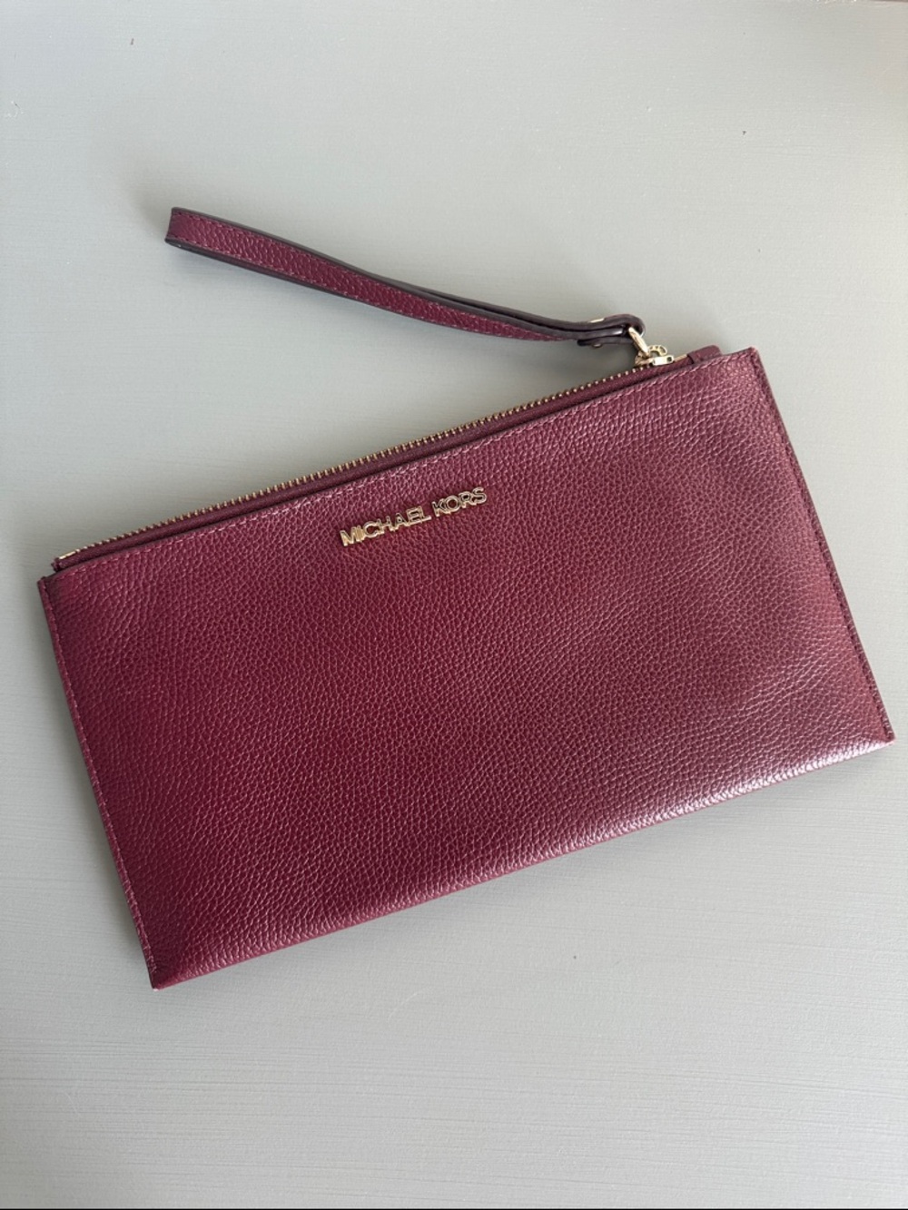 Michael Kors Plum Leather Wristlet with Gold Hardware